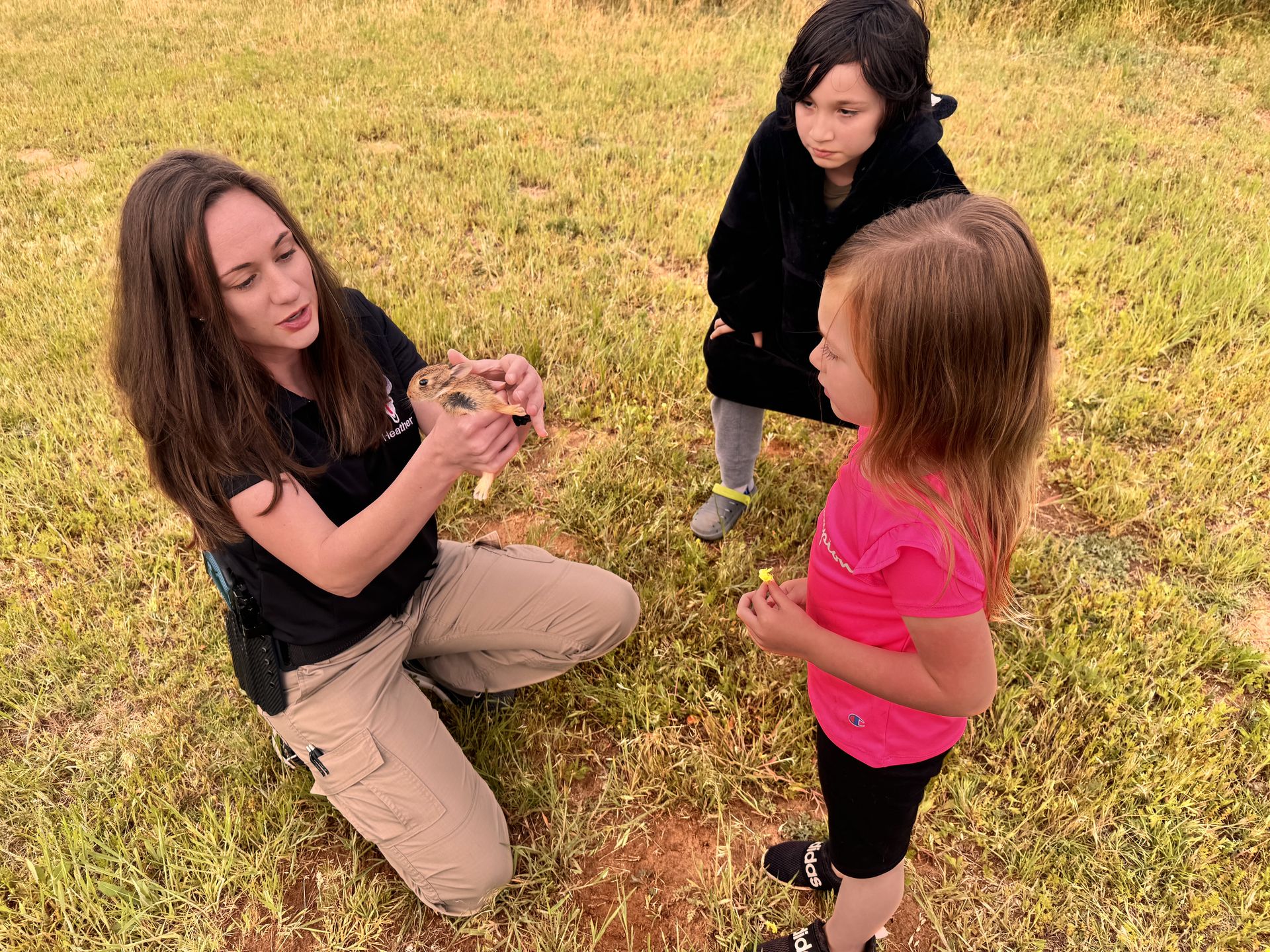 Heather with children in the field